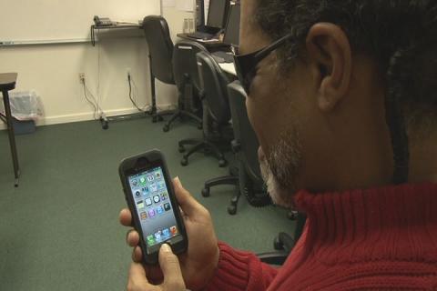 Blind man demonstrates how he uses his smart phone apps to give him information that he can't see with his eyes.