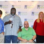 The 2017 MVP Awards Winners lined up in front of the Walton Options backdrop - from left to right: Gerald Powell, Marty Torcius, Spencer Gartrell, Robbie Breshears, Barney's Pharmacy representatives (a woman and a man)