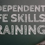 Independent Life Skills Training text on a blackboard background